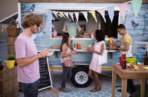 customers-having-snacks-from-food-truck-EDLBVPX.jpg